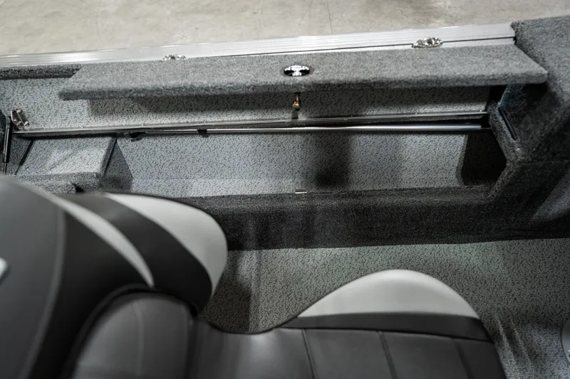 Slide: The Image of 2025 Lund 1875 Impact boat interior with storage compartment and seating. - 27
