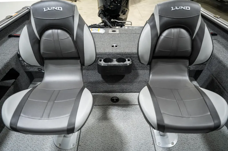 Slide: The Image of 2025 Lund 1875 Impact boat interior with two gray seats and cup holders. - 28