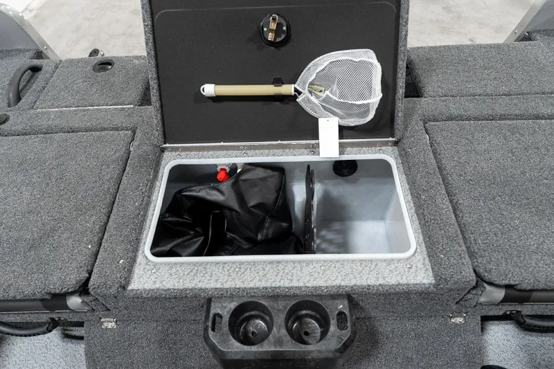 Slide: The Image of 2025 Lund 1875 Impact boat storage compartment with fishing net and accessories. - 31