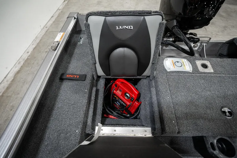 Slide: The Image of 2025 Lund 1875 Impact boat interior with storage compartment and seat. - 34