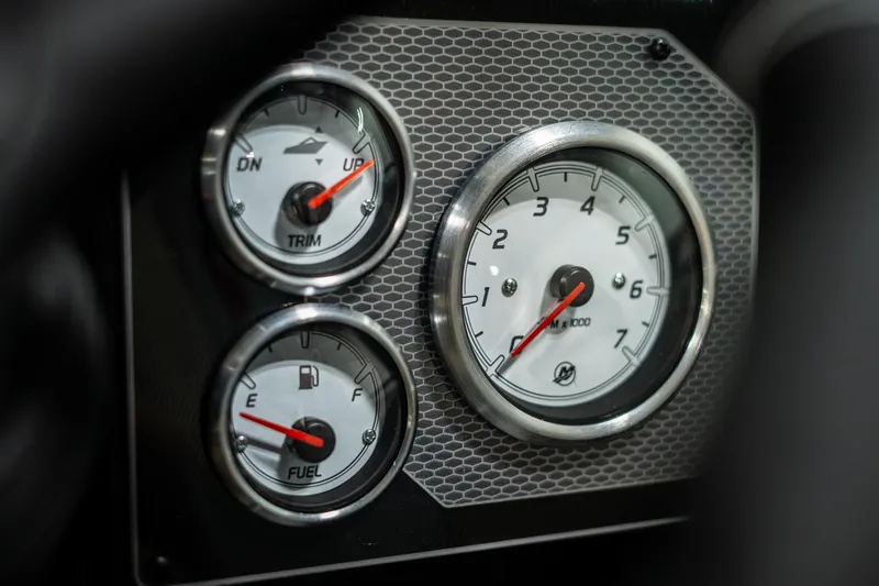 Slide: The Image of Dashboard gauges of 2025 Lund 1875 Impact boat, showing trim, fuel, and RPM. - 39