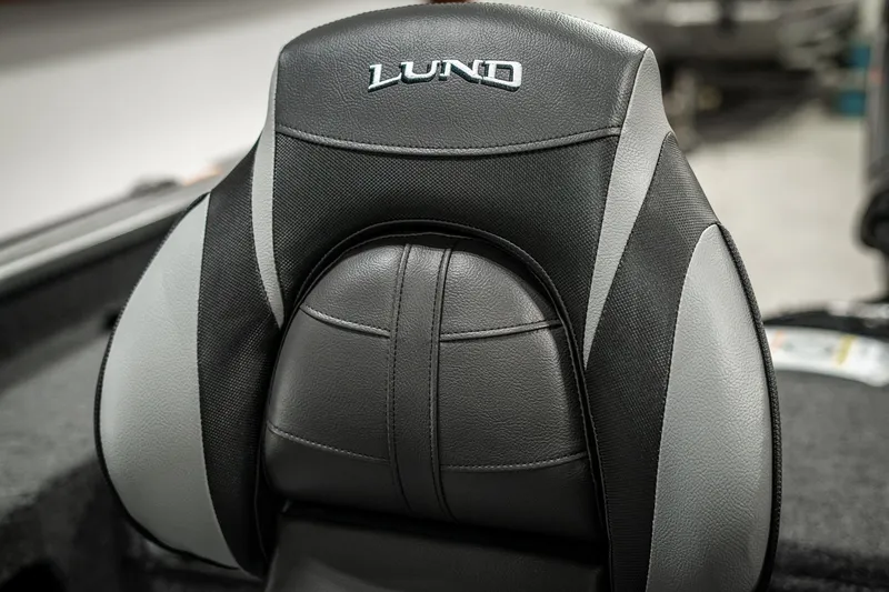 Slide: The Image of Lund 1875 Impact 2025 boat seat, black and gray design, close-up view. - 42