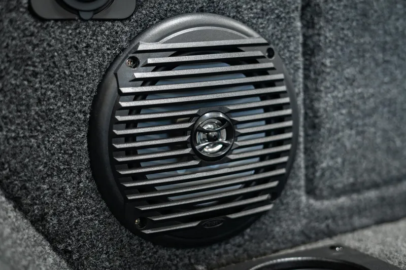 Slide: The Image of Close-up of a speaker in a 2025 Lund 1875 Impact boat interior. - 43