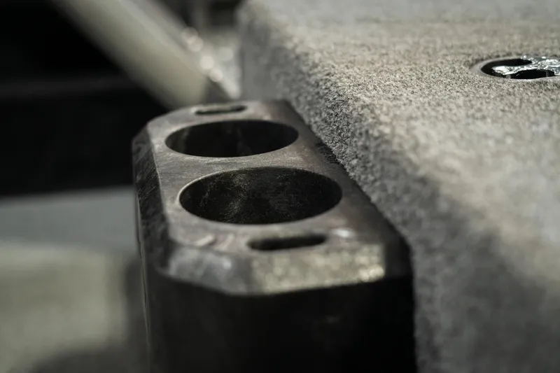 Slide: The Image of Close-up of 2025 Lund 1875 Impact boat interior detail, featuring dual cup holders. - 44