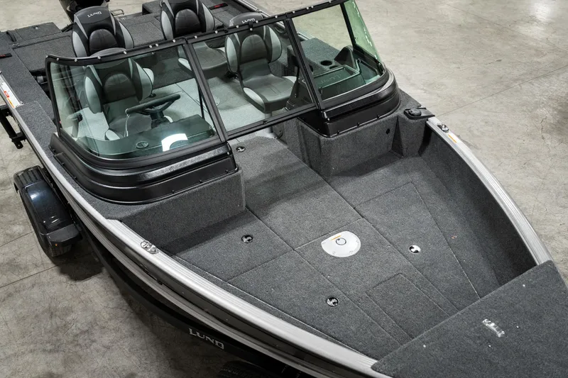 Slide: The Image of 2025 Lund 1875 Impact boat with spacious seating and sleek design. - 9