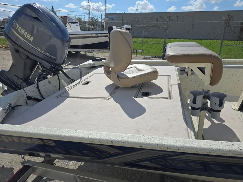 Slide: The Image of 2020 Xpress XP18CC boat with Yamaha outboard motor, featuring seating and storage. - 13