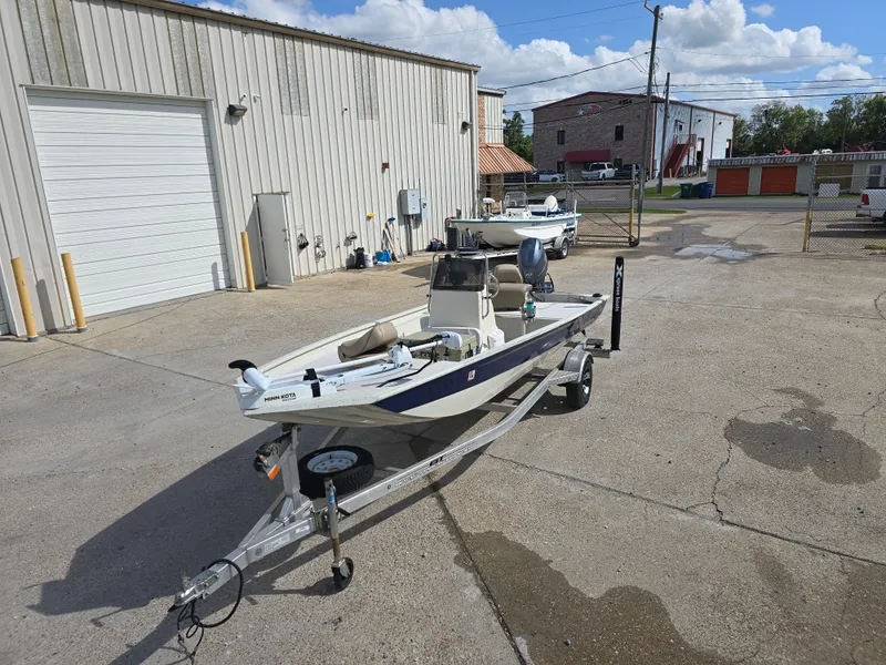 Slide: The Image of 2020 Xpress XP18CC boat on trailer in industrial parking lot. - 3