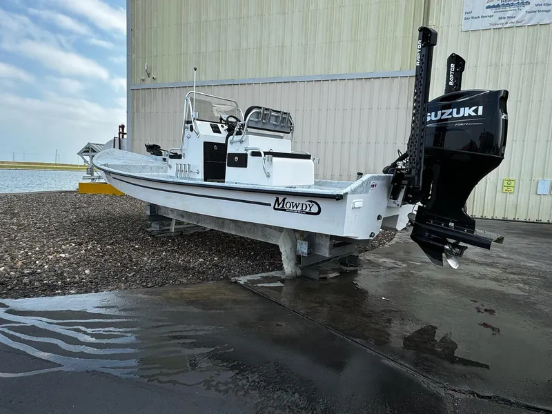 Slide: The Image of 2024 Mowdy 25 Catamaran with Suzuki engine on dry dock. - 12