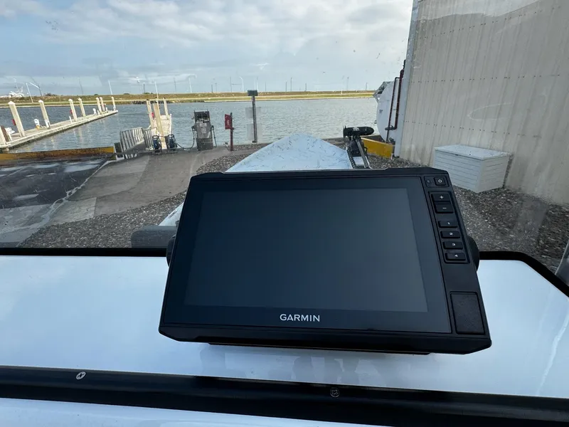 Slide: The Image of Garmin navigation system on 2024 Mowdy 25 Catamaran, dockside view. - 18