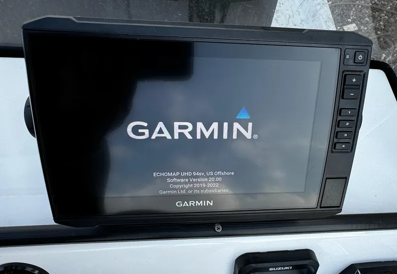 Slide: The Image of Garmin ECHOMAP UHD display on 2024 Mowdy 25 Catamaran dashboard. - 19