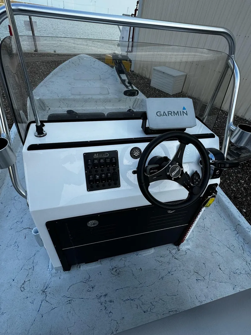 Slide: The Image of 2024 Mowdy 25 Catamaran boat console with Garmin navigation system. - 24