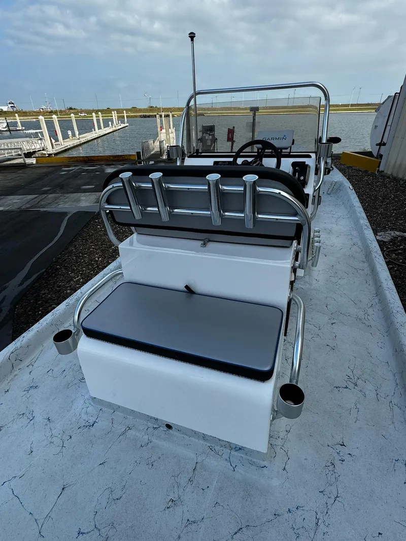 Slide: The Image of 2024 Mowdy 25 Catamaran boat at dock, featuring sleek seating and modern design. - 28