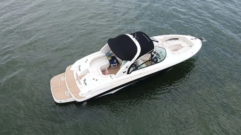 Slide: The Image of 2008 Sea Ray 290 SLX boat on calm water, aerial view. - 10