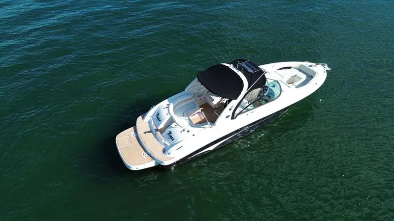 Slide: The Image of 2008 Sea Ray 290 SLX boat cruising on open water. - 14
