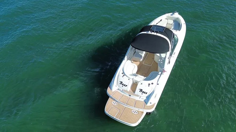 Slide: The Image of 2008 Sea Ray 290 SLX boat on open water, aerial view. - 17