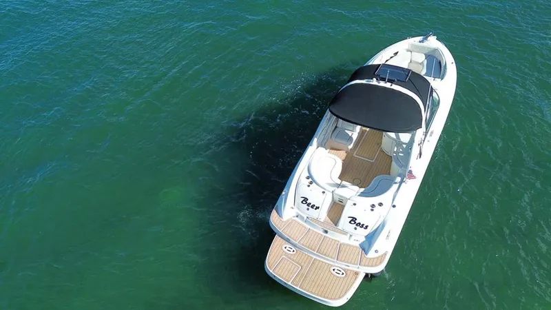 Slide: The Image of Aerial view of 2008 Sea Ray 290 SLX boat on clear water. - 18