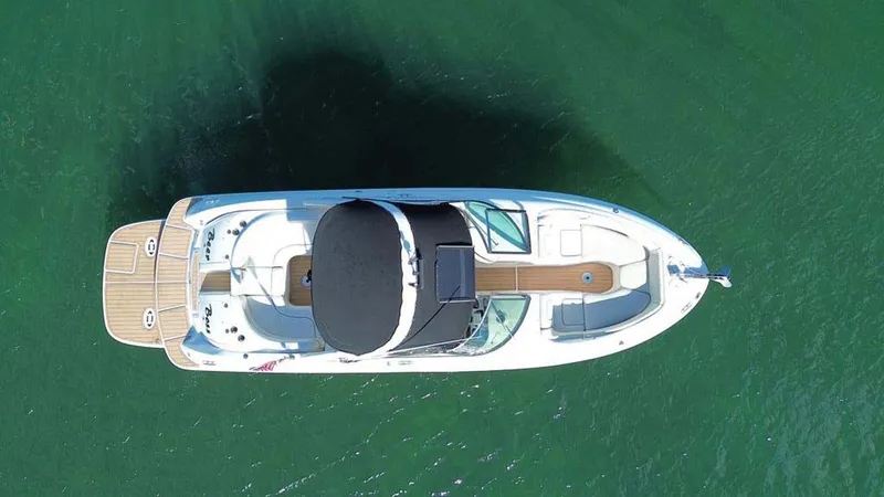 Slide: The Image of Aerial view of 2008 Sea Ray 290 SLX boat on green water. - 20