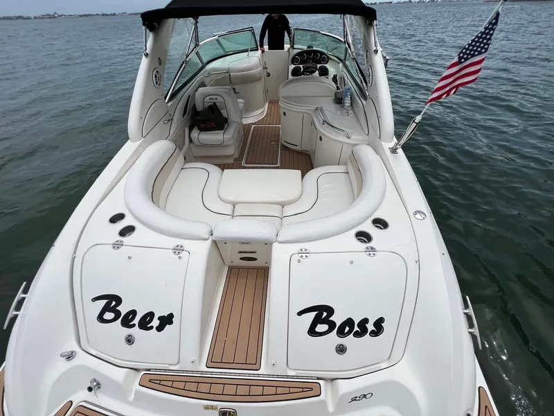 Slide: The Image of 2008 Sea Ray 290 SLX boat with "Beer Boss" text, American flag, and spacious seating. - 7
