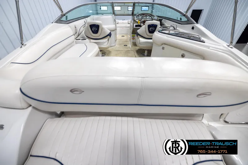 Slide: The Image of 2008 Crownline 240 EX boat interior with white seating and modern dashboard. - 13