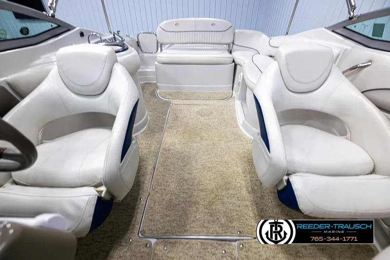 Slide: The Image of Interior of a 2008 Crownline 240 EX boat with white seating and carpeted floor. - 17