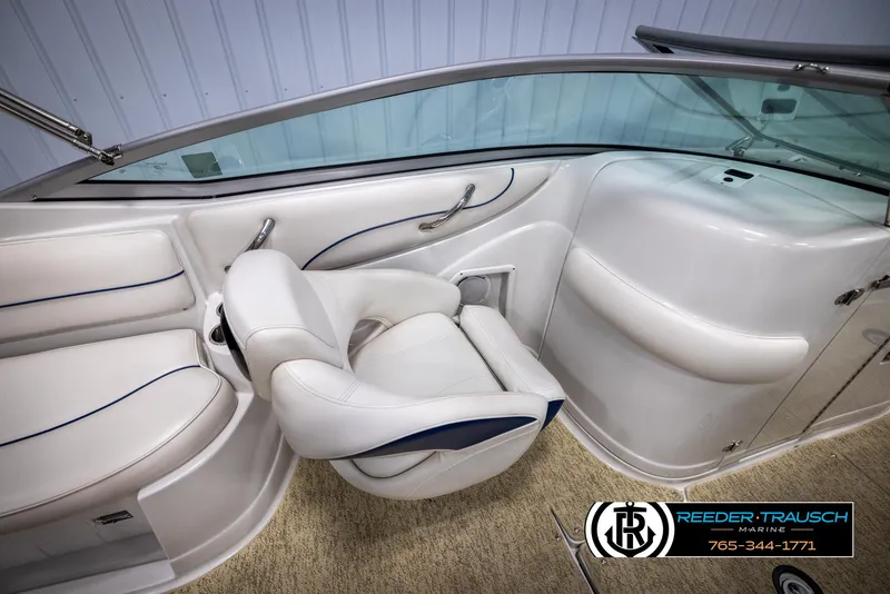 Slide: The Image of 2008 Crownline 240 EX boat interior with white seating and sleek design. - 21