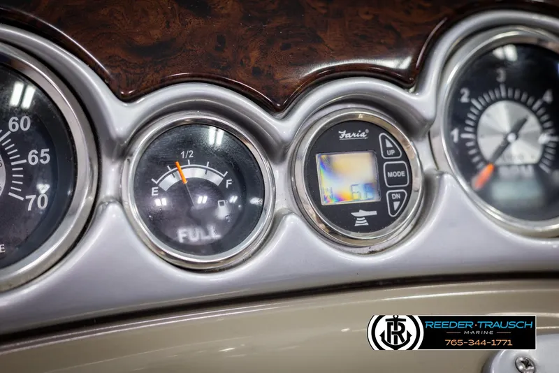 Slide: The Image of Dashboard gauges of a 2008 Crownline 240 EX boat, featuring fuel and speed indicators. - 31