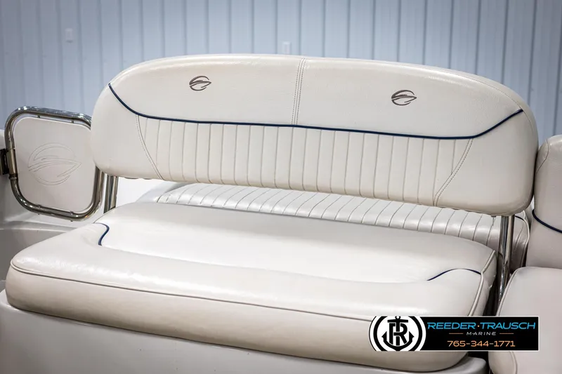 Slide: The Image of 2008 Crownline 240 EX boat seating with white upholstery and logo detail. - 37