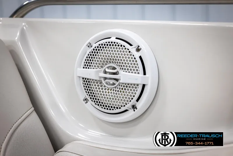 Slide: The Image of White speaker on 2008 Crownline 240 EX boat interior, near beige seating. - 39