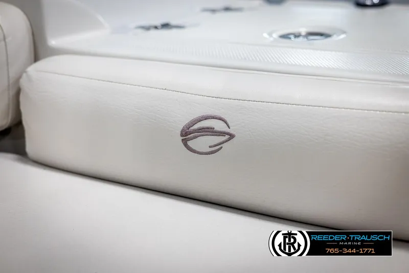 Slide: The Image of 2008 Crownline 240 EX boat interior with logo on white upholstery. - 42