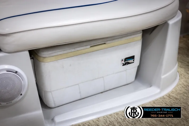 Slide: The Image of 2008 Crownline 240 EX boat interior with built-in cooler and speaker. - 44