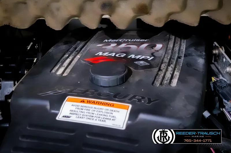 Slide: The Image of MerCruiser 350 MAG MPI engine in 2008 Crownline 240 EX boat, featuring warning label. - 47