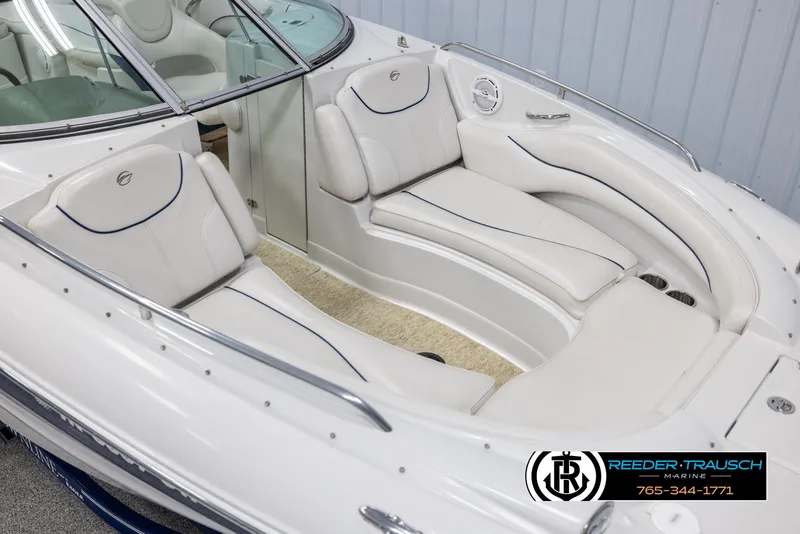 Slide: The Image of 2008 Crownline 240 EX boat interior with white seating and sleek design. - 9