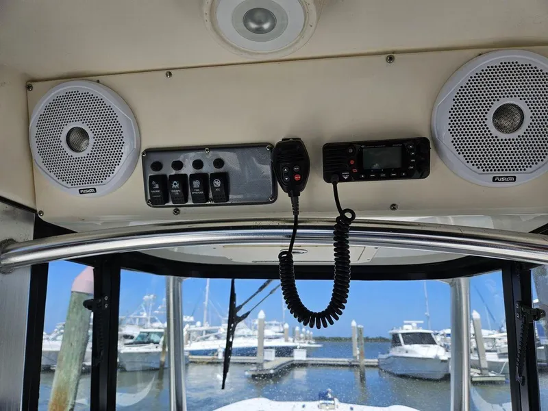 Slide: The Image of Interior view of 2010 World Cat 290 CC boat with speakers and control panel. - 8