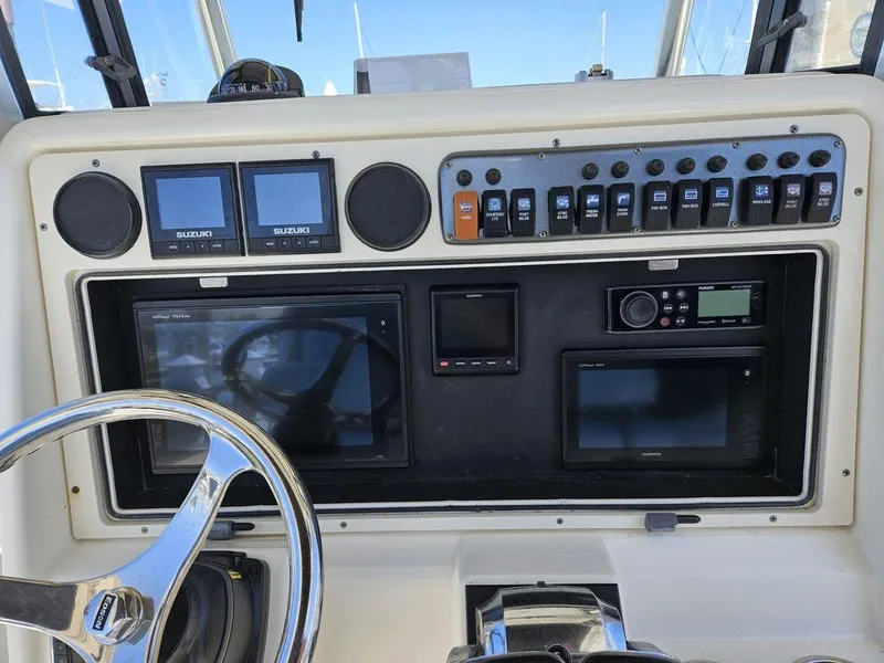 Slide: The Image of Dashboard of 2010 World Cat 290 CC boat with navigation and control systems. - 9