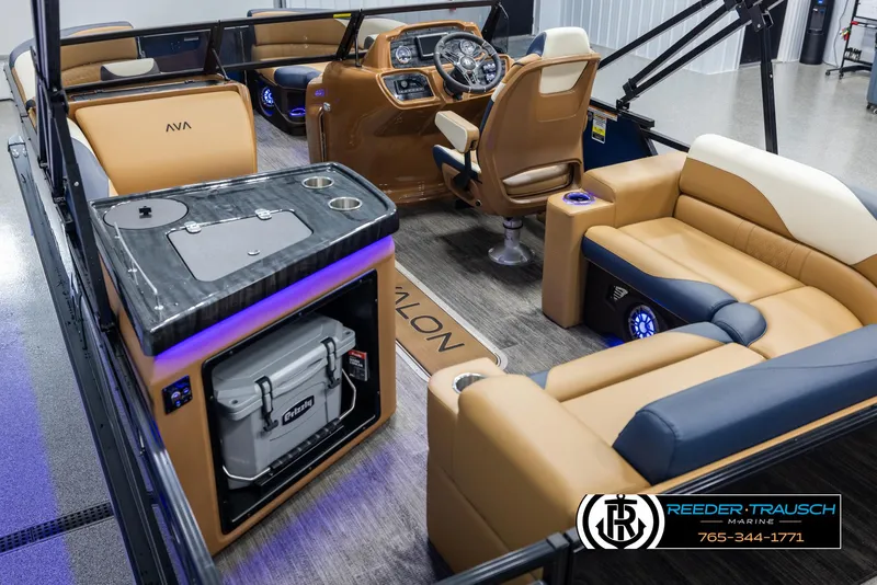 Slide: The Image of 2025 Avalon LSZ ELW boat interior with luxury seating and modern dashboard. - 11