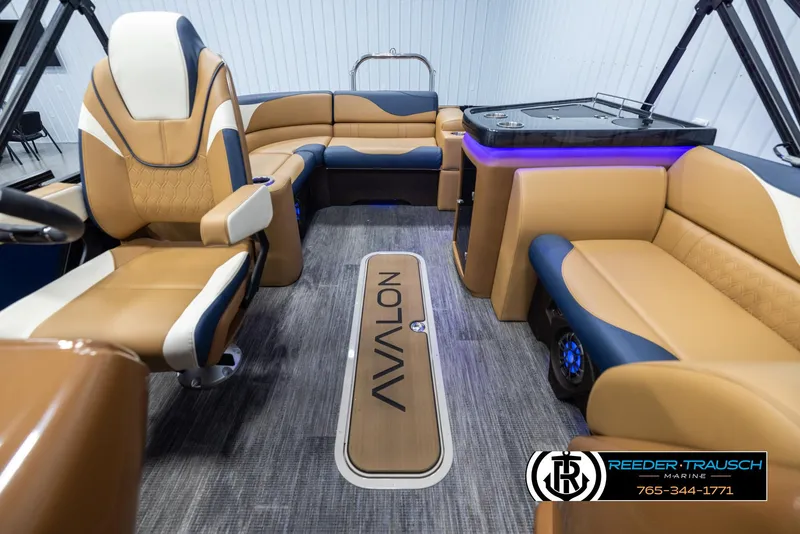 Slide: The Image of Luxurious 2025 Avalon LSZ ELW pontoon boat interior with plush seating and modern design. - 14