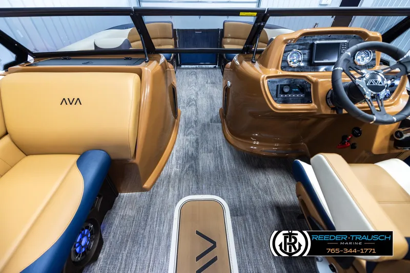 Slide: The Image of 2025 Avalon LSZ ELW boat interior with tan and blue seating, modern dashboard. - 17