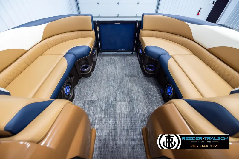 Slide: The Image of Luxurious 2025 Avalon LSZ ELW boat interior with tan and black seating. - 18