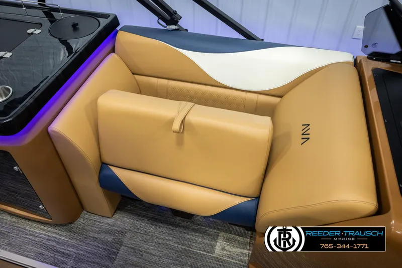 Slide: The Image of Luxurious seating in 2025 Avalon LSZ ELW boat with tan and blue upholstery. - 22