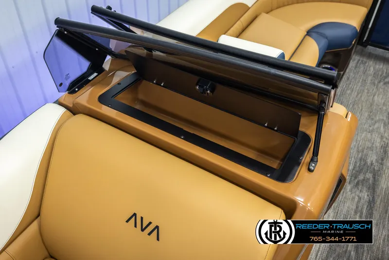 Slide: The Image of 2025 Avalon LSZ ELW boat interior with tan leather seats and storage compartment. - 24