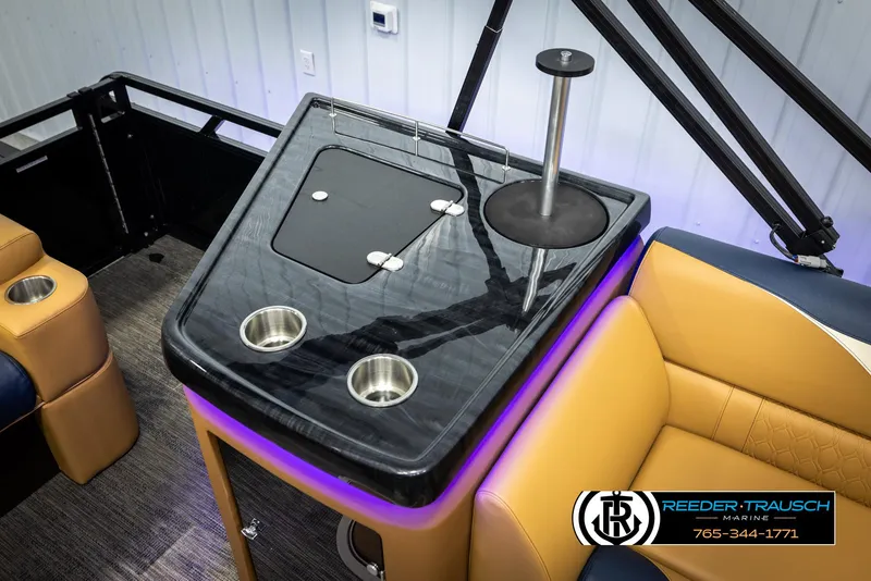 Slide: The Image of 2025 Avalon LSZ ELW boat interior with modern seating and cup holders. - 26