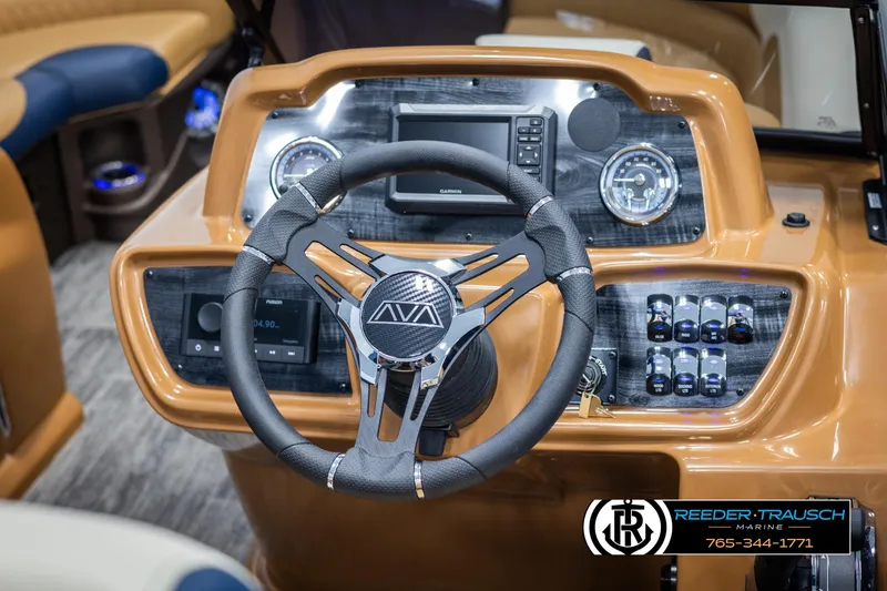 Slide: The Image of 2025 Avalon LSZ ELW boat dashboard with steering wheel and control panel. - 30