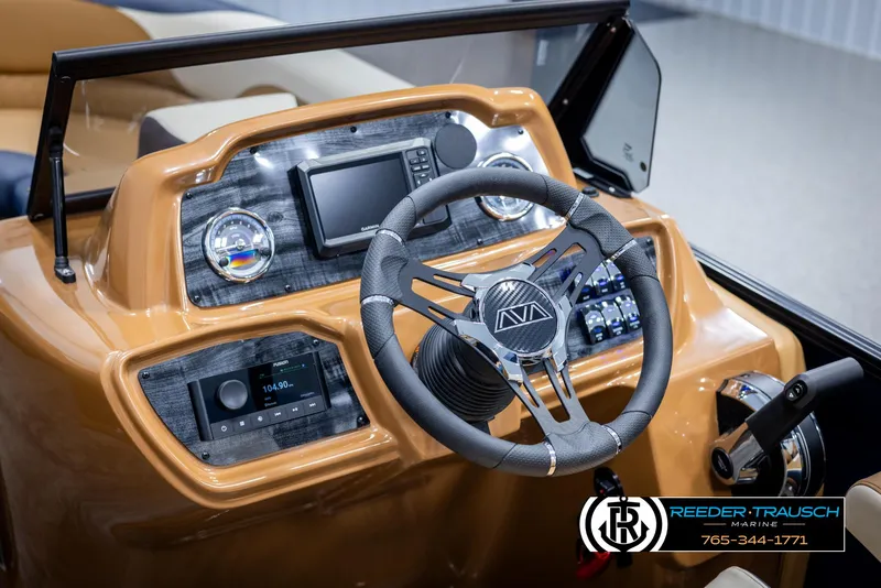 Slide: The Image of 2025 Avalon LSZ ELW boat dashboard with steering wheel and control panel. - 31