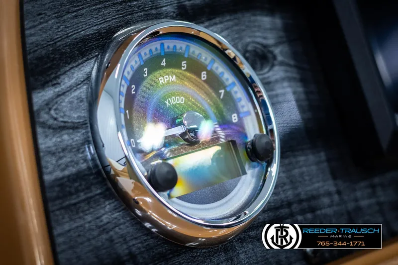 Slide: The Image of 2025 Avalon LSZ ELW dashboard tachometer with chrome trim and wood grain background. - 34