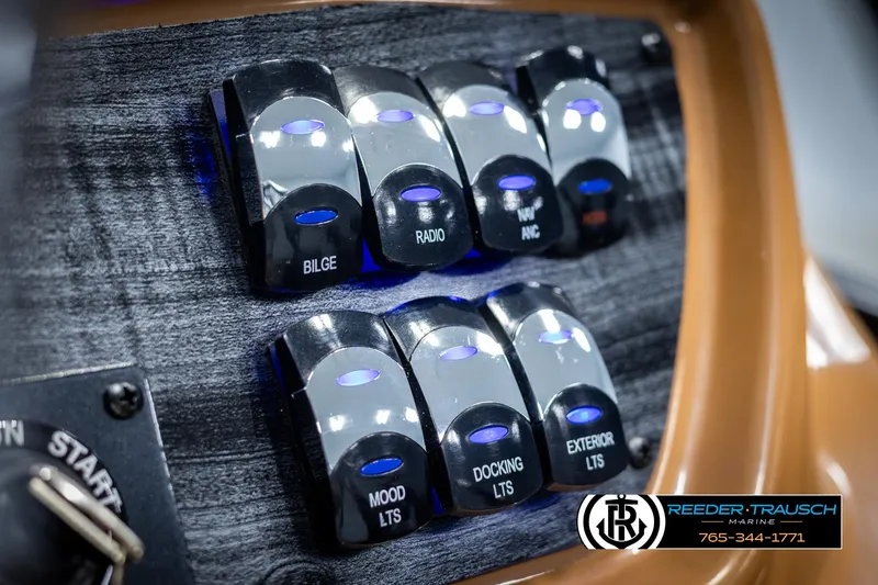 Slide: The Image of Control panel of 2025 Avalon LSZ ELW boat with labeled switches. - 37