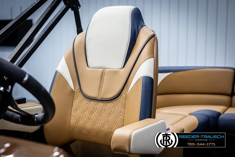 Slide: The Image of Luxurious 2025 Avalon LSZ ELW boat seat with tan and navy upholstery. - 38