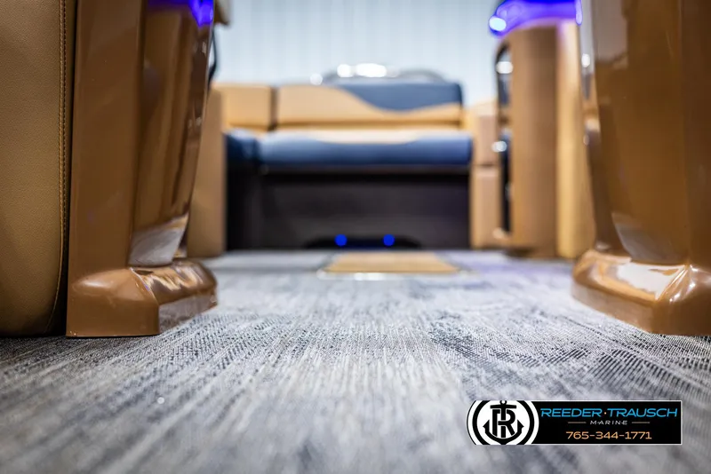 Slide: The Image of Interior view of 2025 Avalon LSZ ELW boat with plush seating and carpeted flooring. - 46