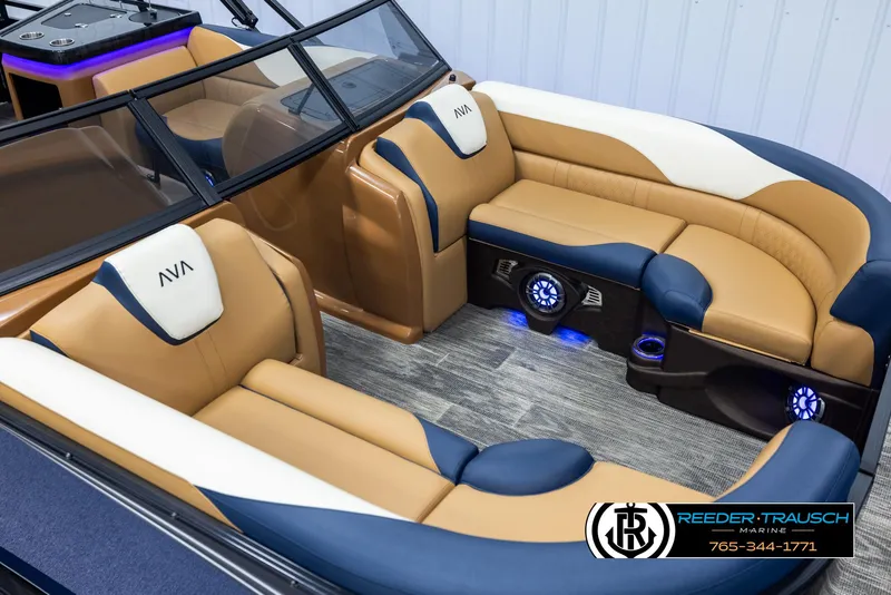 Slide: The Image of Luxurious 2025 Avalon LSZ ELW boat interior with tan and blue seating, featuring LED lighting. - 9