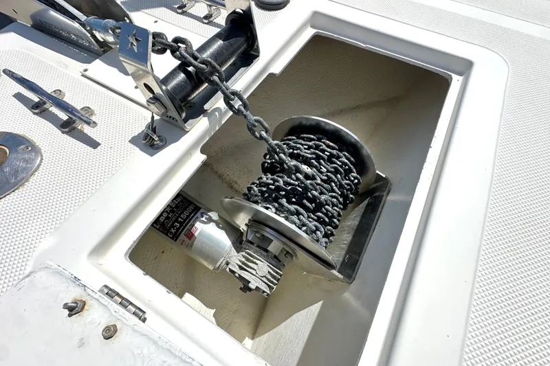Slide: The Image of Anchor chain and winch on a 2012 Davis Rock Harbor 25 boat deck. - 15
