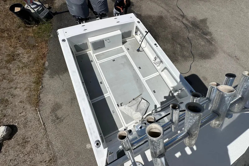 Slide: The Image of Overhead view of 2012 Davis Rock Harbor 25 boat deck, featuring spacious layout and rod holders. - 18